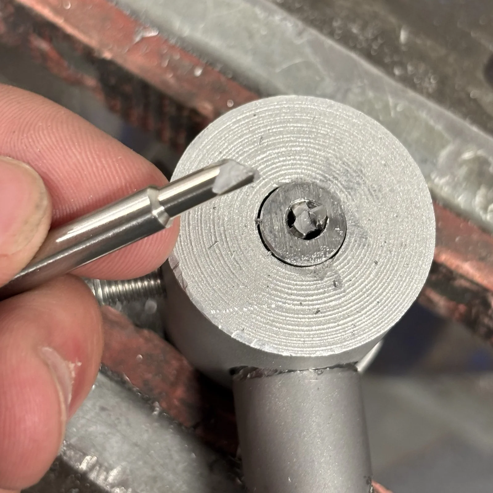A tap snapped off deep inside the silver-steel axle