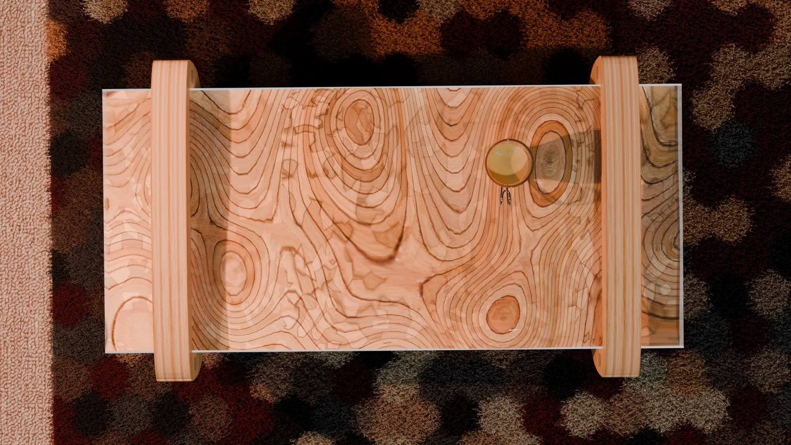 Bird's-eye view of the table — the layered-wood top reading as topographic contours under a clear surface